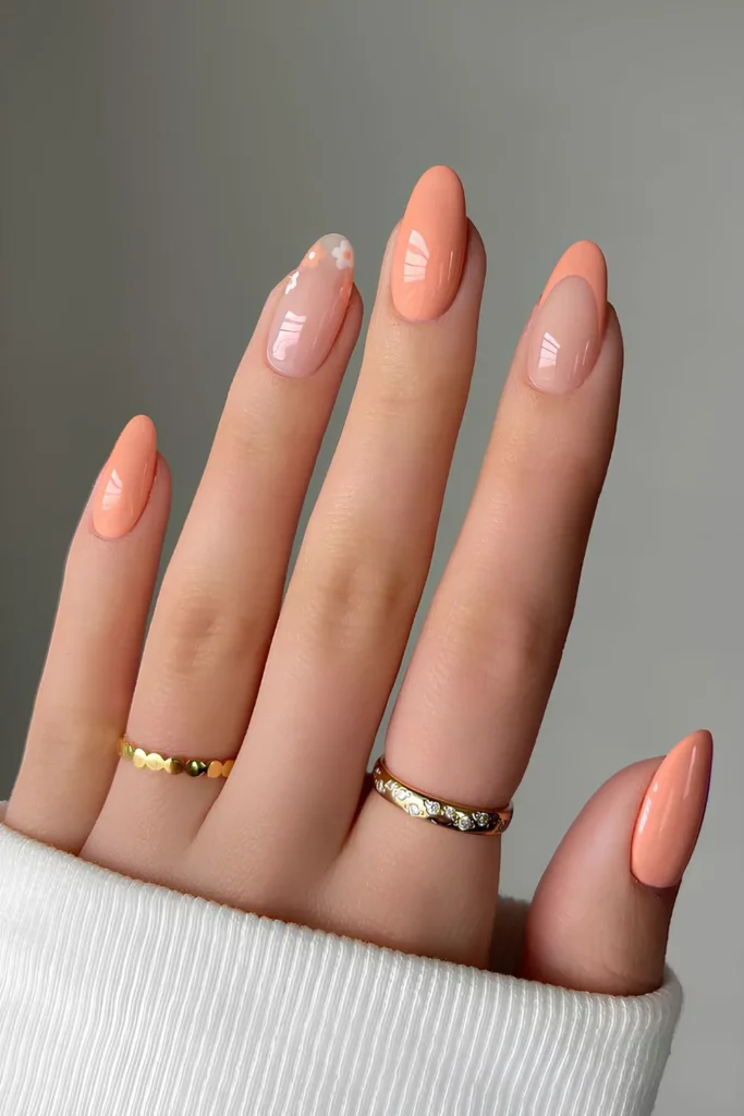 Popular Fall Nail Colors 2025–2026 You’ll Be Obsessed With 3 Peach Almond Manicure with Floral Accent
